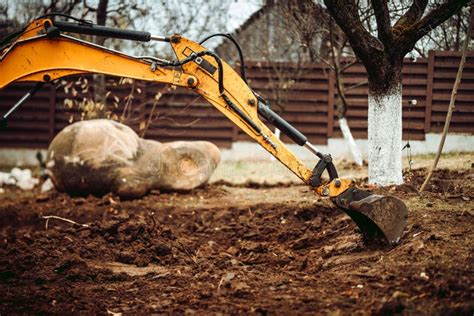 Yellow Excavator Loading Soil Into A Dumper Truck Stock Image Image