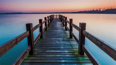 Download Sunset Lake Wooden Man Made Pier 4k Ultra Hd Wallpaper