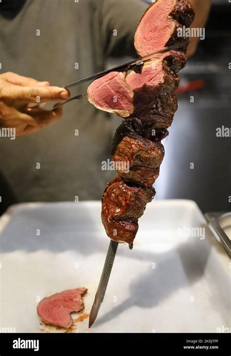 Picanha Is A Bbq Steak Meat Grilled In Charcoal Knife Cutting On