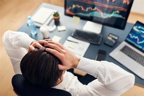 Premium Photo Worried Businessman Looking At Charts Stressed By News