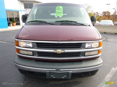 1999 Dark Carmine Red Metallic Chevrolet Express 1500 Passenger Conversion Van 87523729 Photo