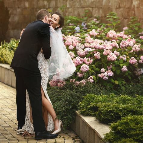 Gorgeous Brunette Sexual Bride Hugging With Handsome Groom In Ca Stock