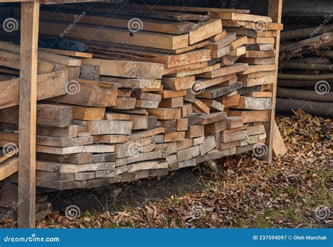 Pile Of Stacked Triangle Firewood Prepared For Fireplace And Boiler