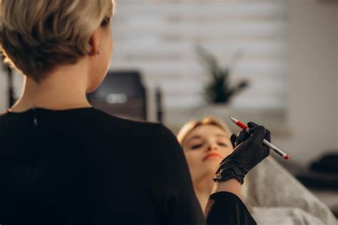 Premium Photo Young Woman Undergoing Procedure Of Permanent Lip