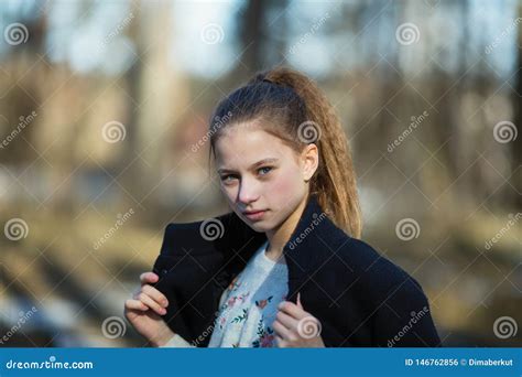 Twelve Year Old Girl In The Park Posing For The Camera Stock Photo