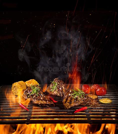 Beef Steaks On The Grill With Flames Stock Photo Image Of Dinner