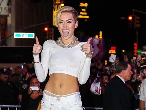 Miley Cyrus Appears Topless On Christmas Card You