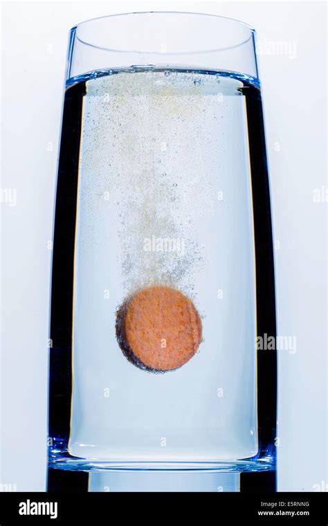 Vitamin C Tablet Dissolving In A Glass Of Water Stock Photo Alamy