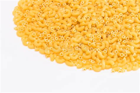 A Heap Of Uncooked Chifferi Rigati Pasta On White Background Stock