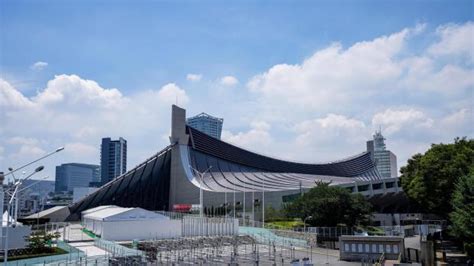 Tokyo Olympics begin with muted ceremony and empty stadium