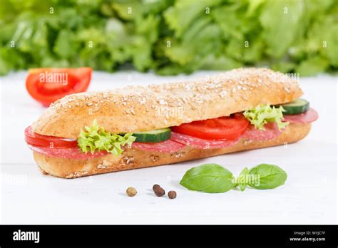 Sub Sandwich Whole Grain Grains Baguette With Salami Ham On Wooden