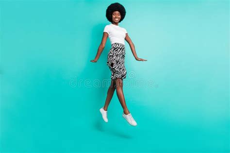 Photo Of Impressed Adorable Dark Skin Lady Wear Casual Clothes Smiling