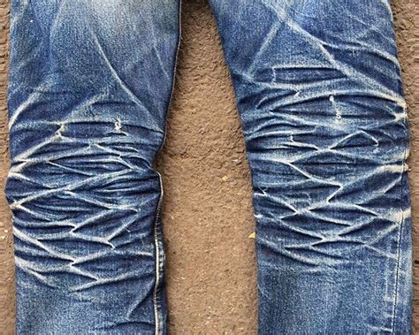 Faded Denim Has Become A Common Jeans Style Worn By Males And Females