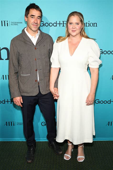 Amy Schumer and Husband Chris Fischer Hold Hands During Red Carpet Date ...