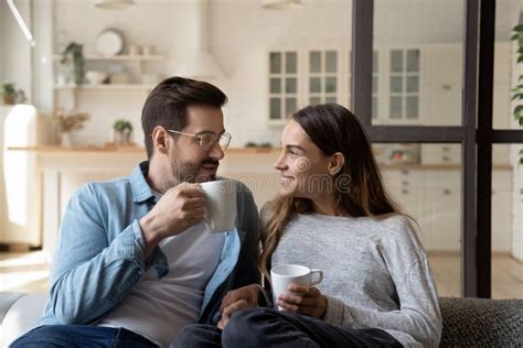 Happy Couple Enjoying Romantic Weekend With Cup Of Hot Tea Stock Photo