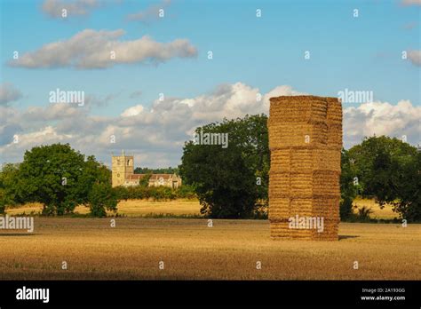 Tall Hay Stack And Village Church At Skipwith North Yorkshire England