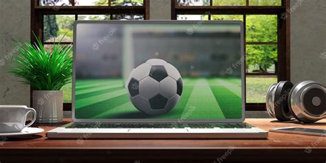 Premium Photo | Laptop with soccer screen on wooden desk at home ...