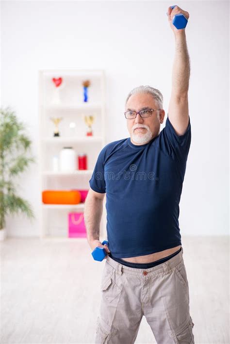 Old Man Doing Sport Exercises Indoors Stock Photo Image Of Physical