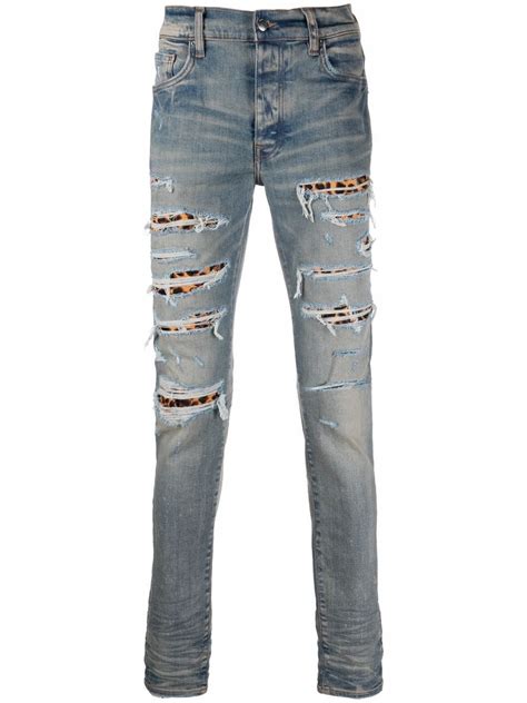 Amiri Ripped Detail Jeans Farfetch