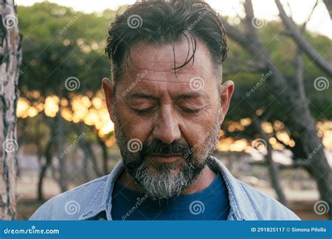 Sad Man Portrait Expression Face Close Up In Outdoor Park One Adult Mature Male People With