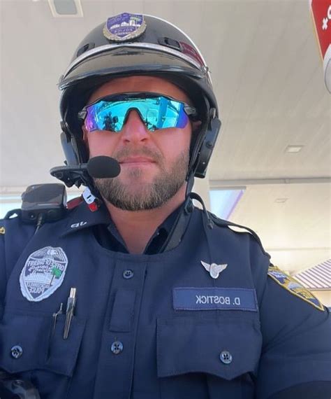 A Man In Uniform With Goggles And A Pilots Helmet Is Looking At The Camera