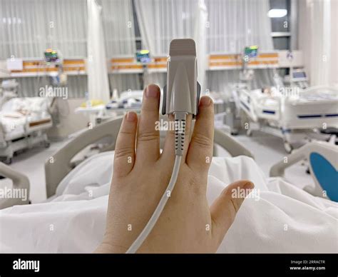 Pulse Oximetry Probe On A Patient Hand In Intensive Care Unit Stock