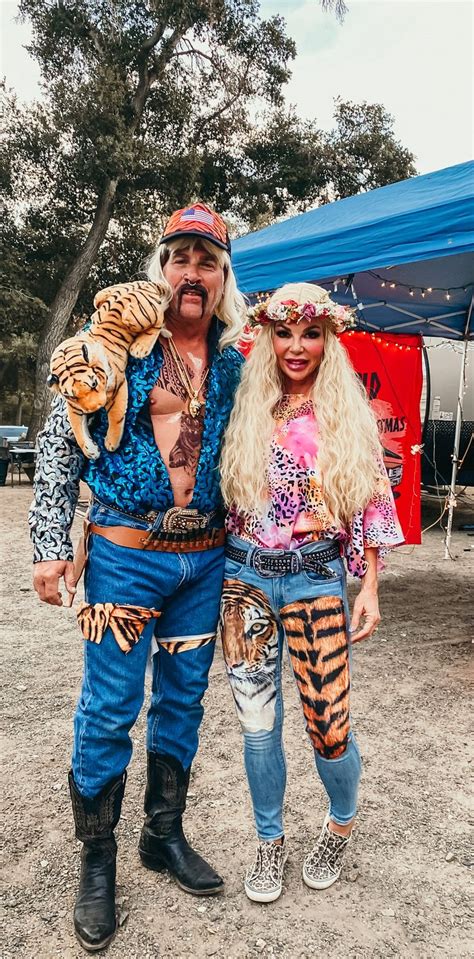 The Man And Woman Are Dressed Up In Costumes For An Outdoor Event With