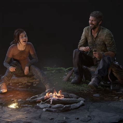 two people sitting around a campfire in the dark with one person ...