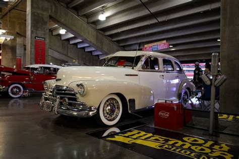 An Old Car Is On Display In A Museum