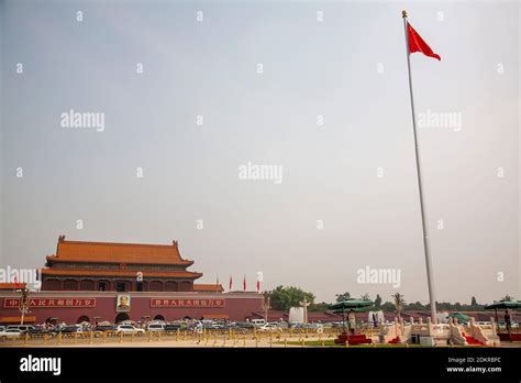 Tiananmen gate with main flag pole in foreground in Tiananmen Square or ...