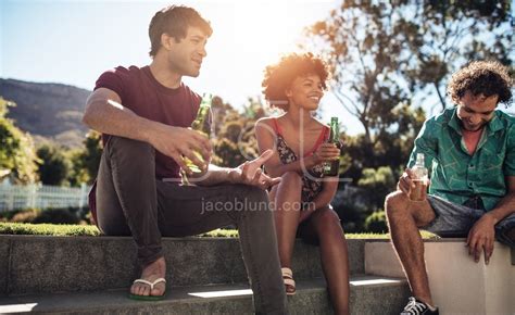 Young People Having Beers Outdoors Jacob Lund Photography Store