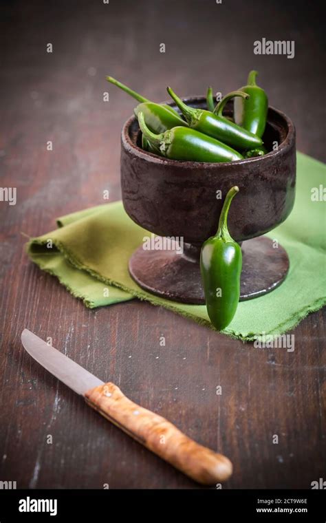 Green Jalapeno Chilis Capsicum Annuum In A Bowl Hi Res Stock