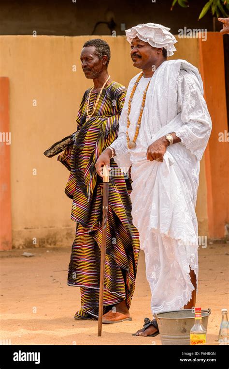 LOME, TOGO - MAR 9, 2013: Unidentified Togolese men in traditional clothes smile. People of Togo ...