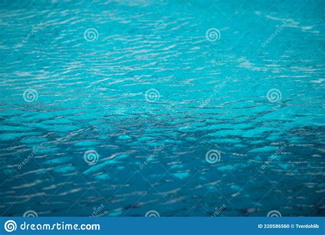 Abstract Ripple Wave And Clear Turquoise Water Surface In Swimming Pool