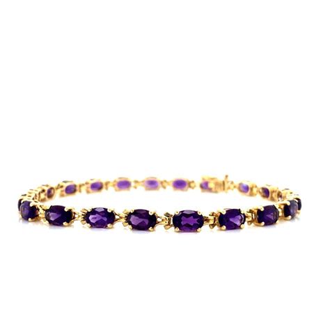 At Auction 14K YELLOW GOLD AMETHYST TENNIS BRACELET