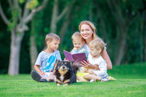 Young Mother Reading Book To Her Two Small Sons Stock Image Image Of