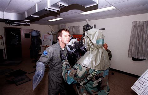 A Crewmember From The 80th Fighter Squadron Receives A Fresh Gas Mask