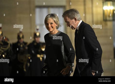 Lvmh Ceo Bernard Arnault R And His Wife French Pianist Helene Mercier Arnault L Arriving At