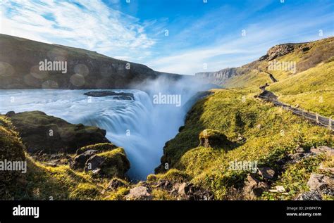 Gullfoss Golden falls waterfall long exposure with hiking track Stock ...