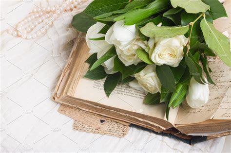 Old books with flowers | High-Quality Education Stock Photos ~ Creative ...