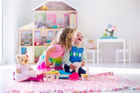 Kids Playing With Stuffed Animals And Doll House Stock Photo - Image ...