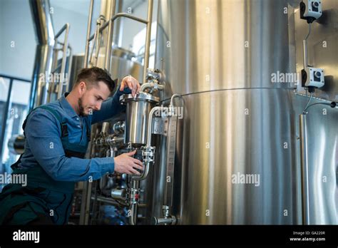 Brewer Checking Pressure At Brewery Stock Photo Alamy