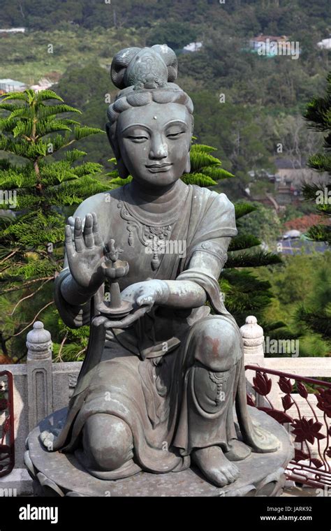 Buddhistic Statue Making Offerings To The Tian Tan Buddha In Hong Kong