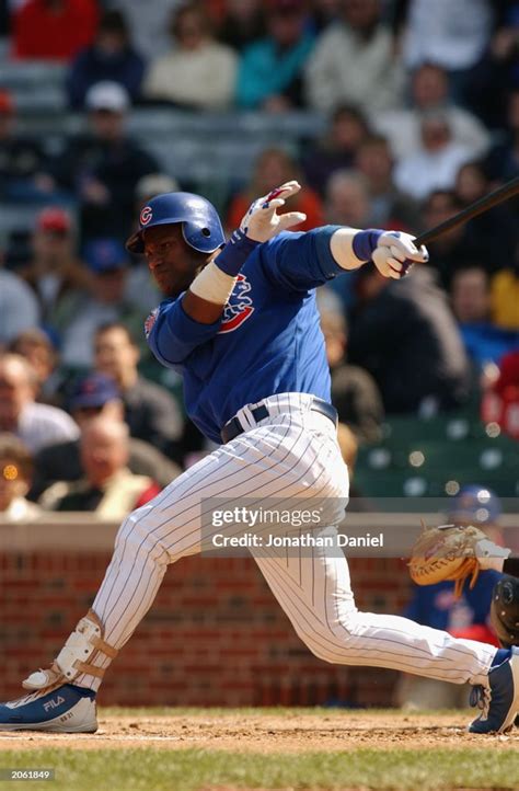 Right Fielder Sammy Sosa Of The Chicago Cubs Swings At The Pitch