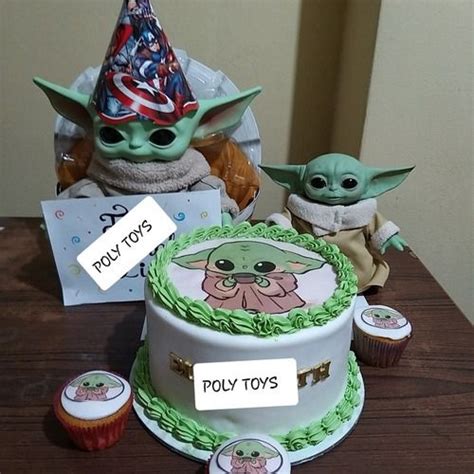 Two Cakes Decorated To Look Like Baby Yoda S And One With An American