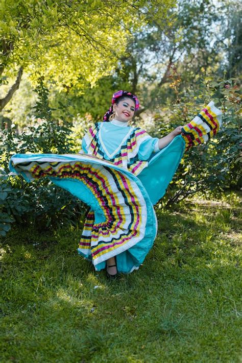 A Woman in Blue Dress Dancing · Free Stock Photo