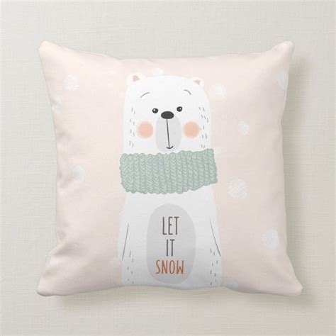 A White Pillow With A Polar Bear Wearing A Scarf On Its Neck And The