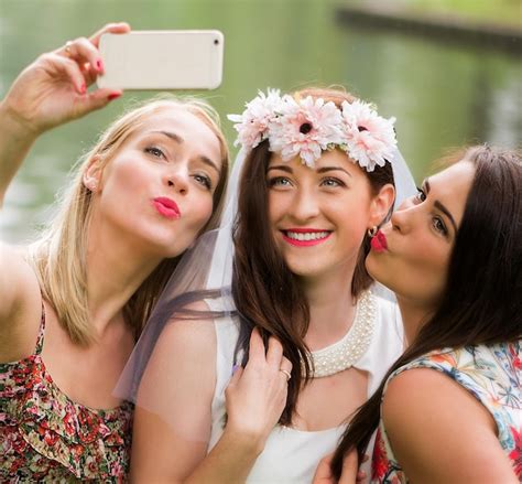 Premium Photo Happy Bride With Friends Taking Selfie