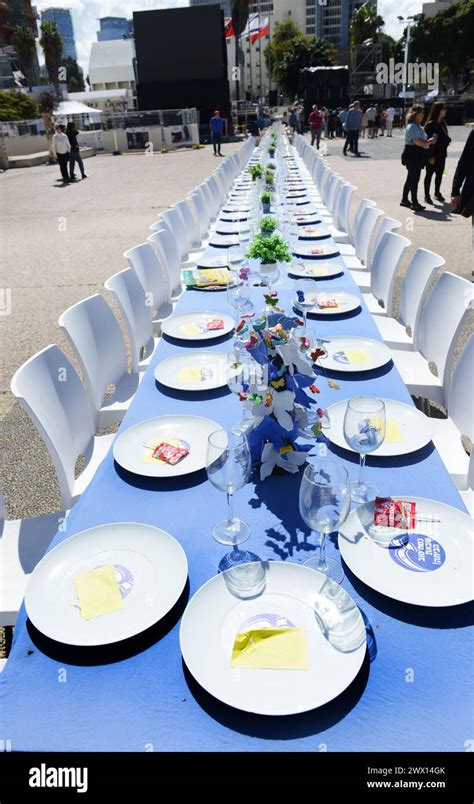 An Installation Of A Sabbath Dinner Table With Chairs For The Hostages