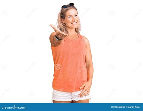 Middle Age Fit Blonde Woman Wearing Casual Summer Clothes And